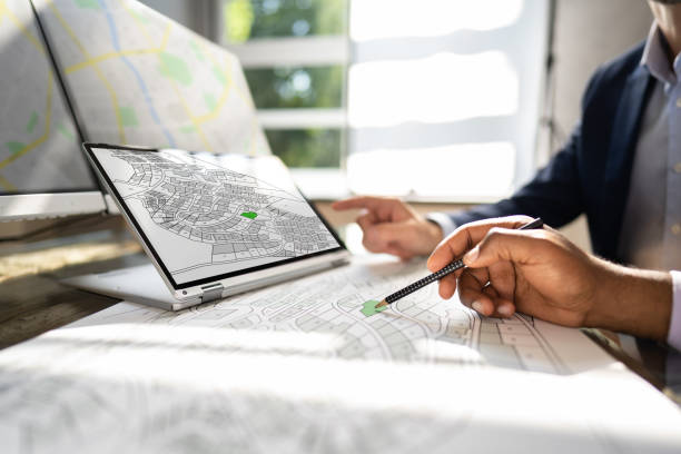 cadastre map and city building survey on laptop